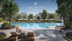 Velora 2 at The Valley by Emaar resort style lagoon pool with palm trees and landscaped relaxation areas in Dubai - Presented by Tohid Fetrat
