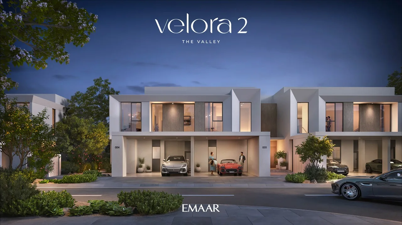 Velora 2 at The Valley by Emaar nighttime townhouse exterior with illuminated modern architecture in Dubai - Presented by Tohid Fetrat
