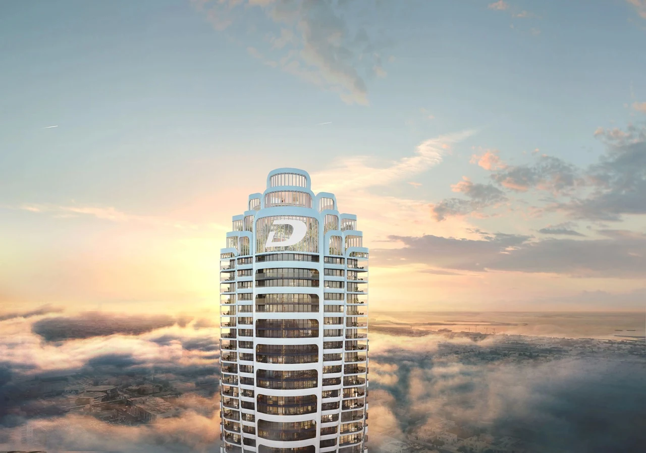 Volta by DAMAC in Downtown Dubai tower crown rising above the clouds at sunrise in Dubai - Presented by Tohid Fetrat