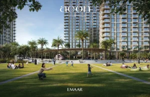 AEON at Dubai Creek Harbour by Emaar Properties residential towers with landscaped lawn, palm trees, shaded seating and outdoor family spaces in Dubai Presented by Tohid Fetrat