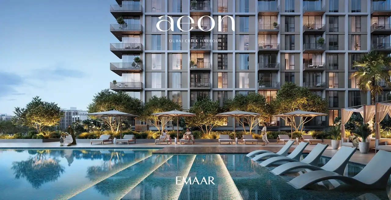AEON at Dubai Creek Harbour by Emaar Properties residential tower facade with pool deck, sun loungers, shaded cabanas and landscaped greenery in Dubai Presented by Tohid Fetrat