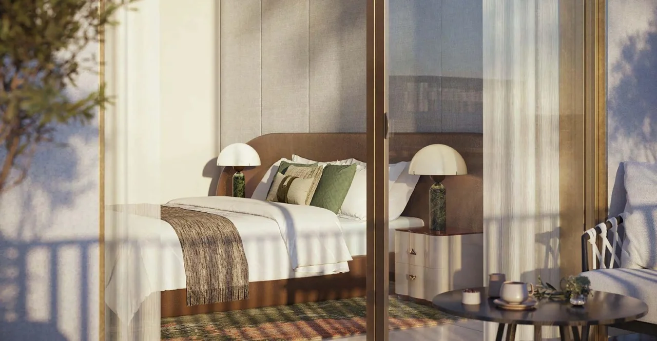 Arancia at The Yards by Beyond Developments bedroom interior viewed from a private terrace with floor to ceiling glazing in Dubai Presented by Tohid Fetrat