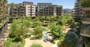 Arancia at The Yards by Beyond Developments central courtyard garden with water features landscaped greenery and residential buildings in Dubai Presented by Tohid Fetrat