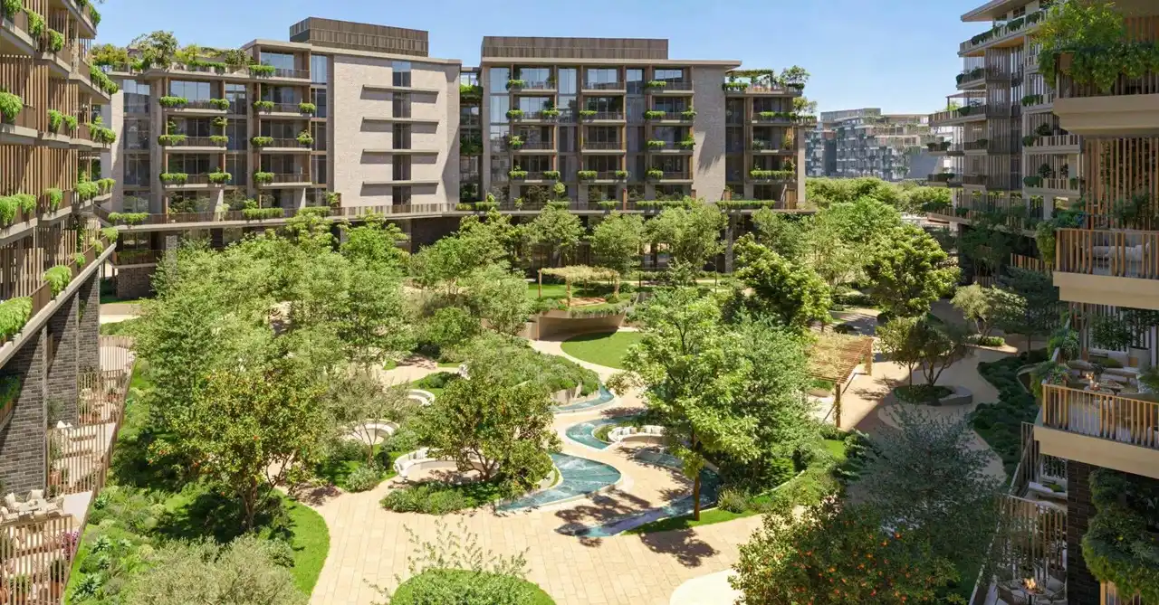 Arancia at The Yards by Beyond Developments central courtyard garden with water features landscaped greenery and residential buildings in Dubai Presented by Tohid Fetrat