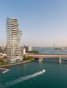 AVA at Palm Jumeirah, Dorchester Collection by OMNIYAT waterfront tower exterior with marina views and contemporary architecture in Dubai Presented by Tohid Fetrat