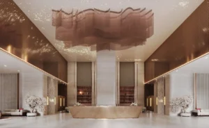 Binghatti Skyblade by Binghatti grand reception lobby with sculptural chandelier luxury concierge desk and elegant interior design in Dubai - Presented by Tohid Fetrat