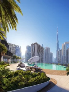 Binghatti Skyblade by Binghatti infinity pool terrace with luxury sun loungers landscaped surroundings and Burj Khalifa views in Dubai - Presented by Tohid Fetrat