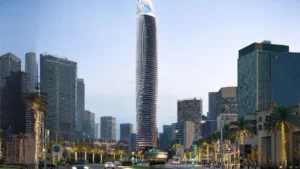 Binghatti Skyblade by Binghatti iconic residential tower rising above a palm lined boulevard with illuminated facade and modern skyline surroundings in Dubai - Presented by Tohid Fetrat