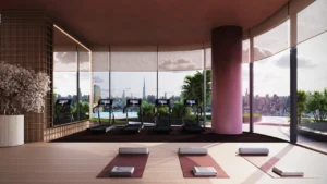 Binghatti Skyblade by Binghatti wellness studio with fitness equipment yoga area floor to ceiling windows and Dubai skyline views in Dubai - Presented by Tohid Fetrat