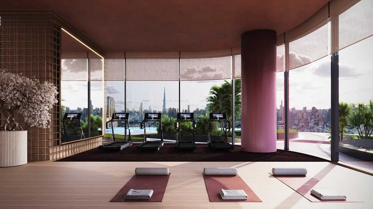 Binghatti Skyblade by Binghatti wellness studio with fitness equipment yoga area floor to ceiling windows and Dubai skyline views in Dubai - Presented by Tohid Fetrat