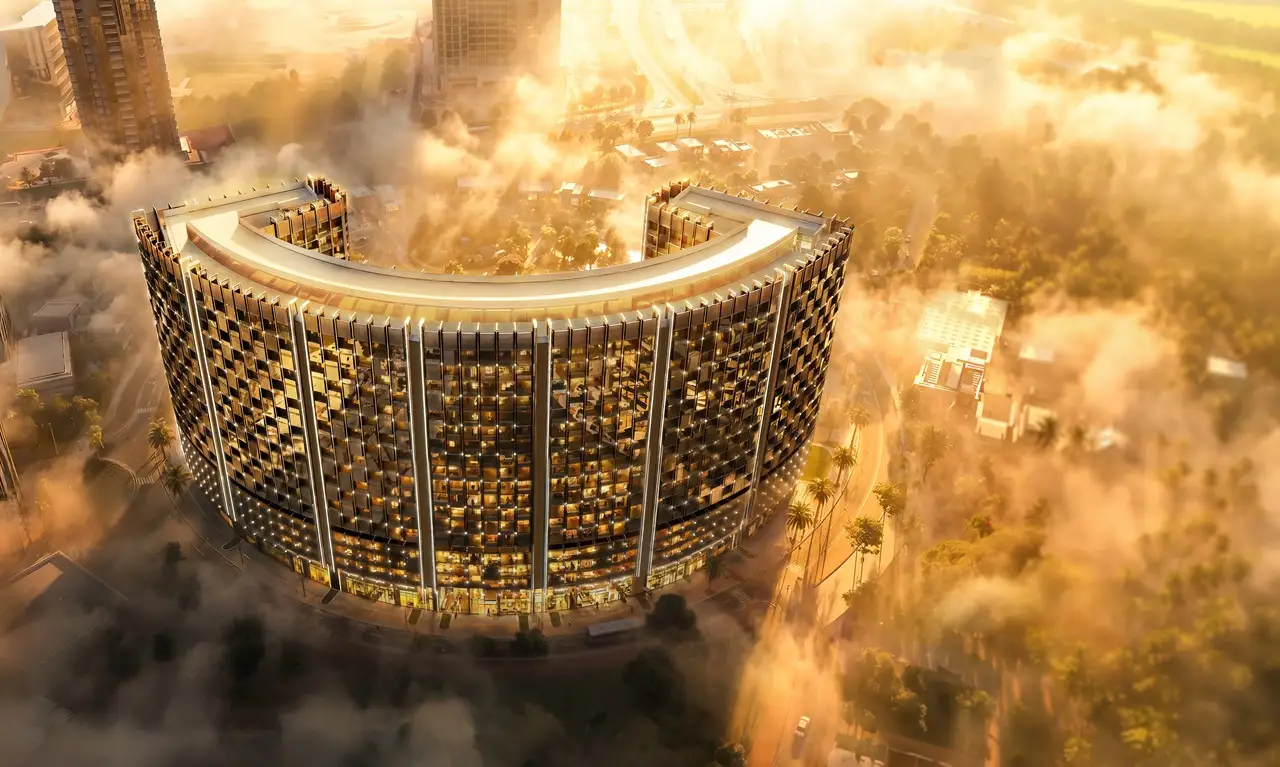 Binghatti Wraith at Al Jaddaf by Binghatti aerial exterior view of the illuminated curved residential tower surrounded by clouds in Dubai - Presented by Tohid Fetrat