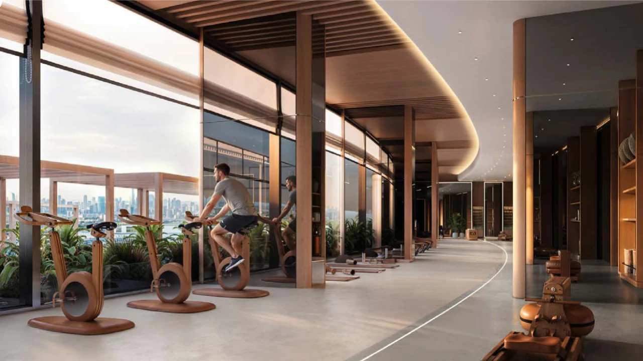 Binghatti Wraith at Al Jaddaf by Binghatti luxury fitness center with panoramic windows, premium exercise equipment and Dubai skyline views in Dubai - Presented by Tohid Fetrat