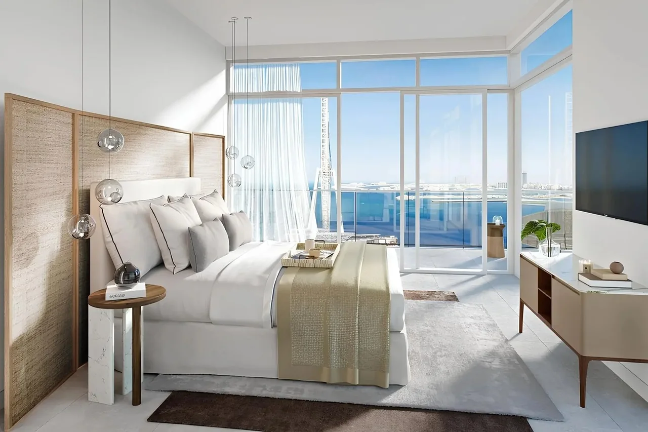 Bluewaters Bay at Bluewaters Island by Meraas contemporary bedroom interior with floor to ceiling windows and waterfront views in Dubai Presented by Tohid Fetrat