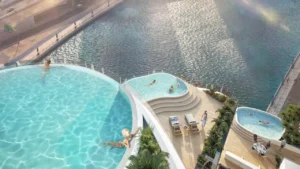 CHIC Tower by DAMAC in Business Bay infinity pool amenity overlooking Dubai Water Canal with luxury leisure decks in Dubai Presented by Tohid Fetrat