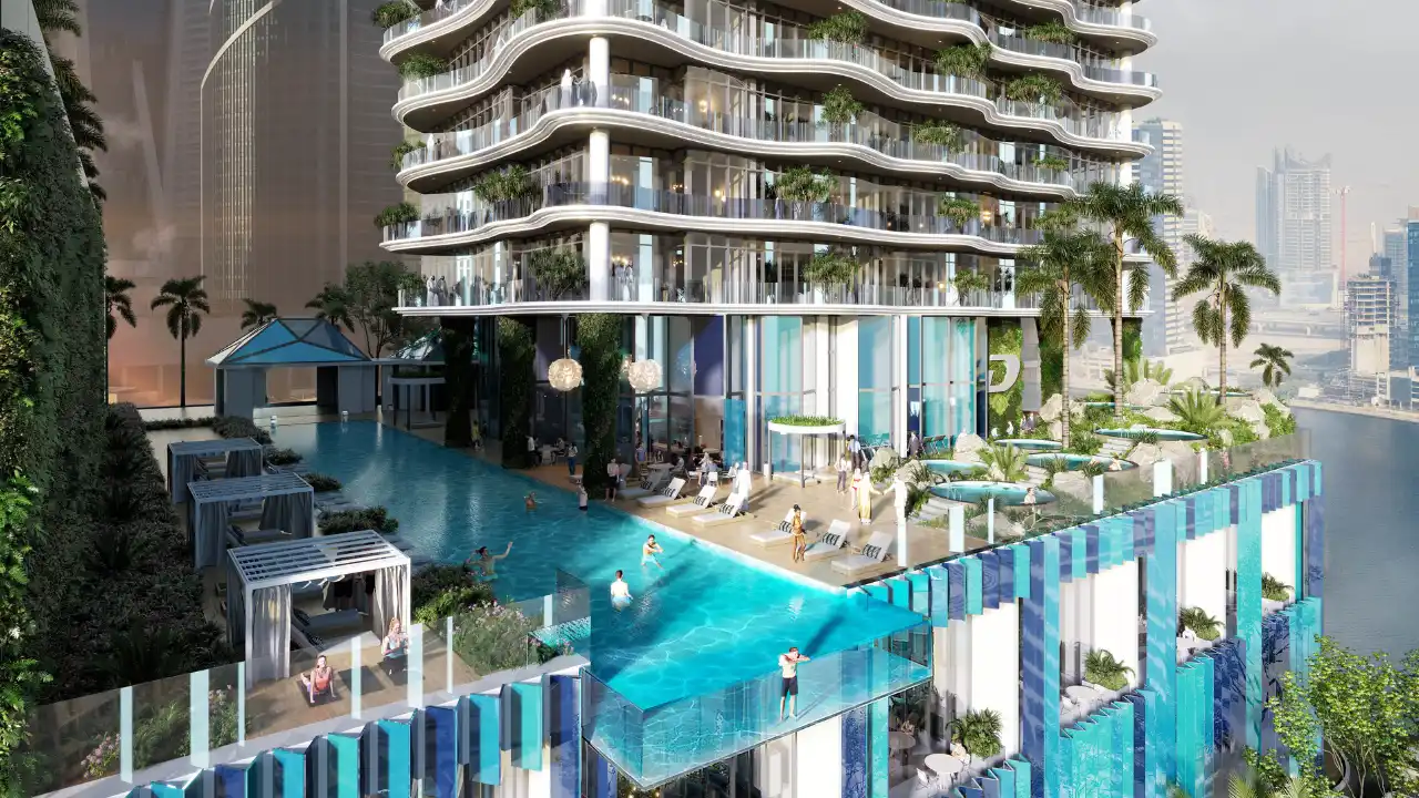 CHIC Tower by DAMAC in Business Bay infinity pool deck with luxury cabanas resort style amenities and canal views in Dubai Presented by Tohid Fetrat