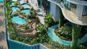 CHIC Tower by DAMAC in Business Bay lagoon style swimming pools with tropical landscaping and resort inspired wellness spaces in Dubai Presented by Tohid Fetrat