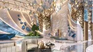 CHIC Tower by DAMAC in Business Bay luxury lobby interior with artistic crystal chandelier sculptural wall features and designer seating in Dubai Presented by Tohid Fetrat
