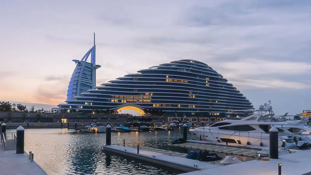 Luxury waterfront development by Dubai Holding featuring contemporary architecture and a premium marina setting Presented by Tohid Fetrat
