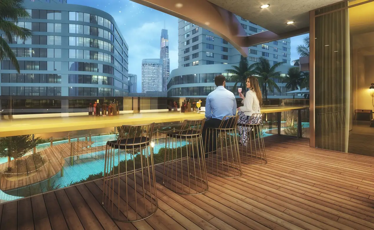 Elegance Tower by DAMAC in Downtown Dubai featuring an outdoor sky lounge overlooking the pool deck and city skyline in Dubai - Presented by Tohid Fetrat