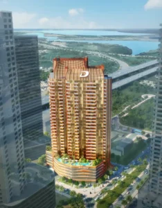 Elegance Tower by DAMAC in Downtown Dubai showcasing the tower within its urban setting with surrounding cityscape views in Dubai - Presented by Tohid Fetrat