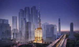Elegance Tower by DAMAC in Downtown Dubai with illuminated tower facade and Burj Khalifa skyline view in Dubai - Presented by Tohid Fetrat