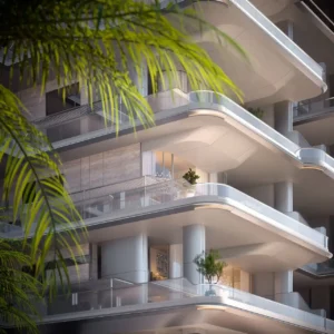 Close-up view of ORLA, Dorchester Collection Dubai showcasing curved beachfront balconies, contemporary architecture, expansive terraces, and luxury residential façade design. Presented by Tohid Fetrat