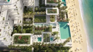 Aerial masterplan view of ORLA, Dorchester Collection, Dubai showcasing beachfront pools, landscaped gardens, private beach access, wellness facilities, and resort-style amenities. Presented by Tohid Fetrat
