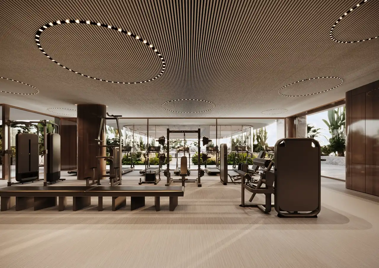 Fitness center at ORLA, Dorchester Collection, Dubai featuring state-of-the-art gym equipment, wellness facilities, personal training spaces, and luxury resident amenities. Presented by Tohid Fetrat