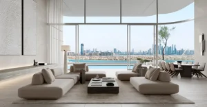 Luxury ORLA residence interior featuring floor-to-ceiling windows, open-plan living space, private terrace, and panoramic Palm Jumeirah and Dubai skyline views. Presented by Tohid Fetrat
