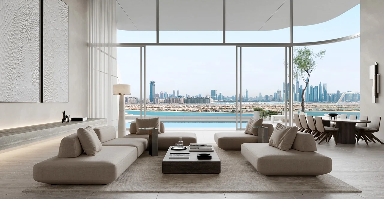 Luxury ORLA residence interior featuring floor-to-ceiling windows, open-plan living space, private terrace, and panoramic Palm Jumeirah and Dubai skyline views. Presented by Tohid Fetrat