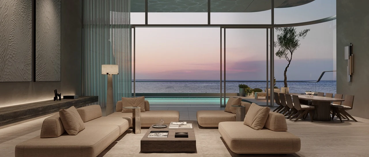 Luxury ORLA residence interior overlooking the Gulf at sunset, featuring floor-to-ceiling windows, private terrace, outdoor dining area, and seamless indoor-outdoor living. Presented by Tohid Fetrat