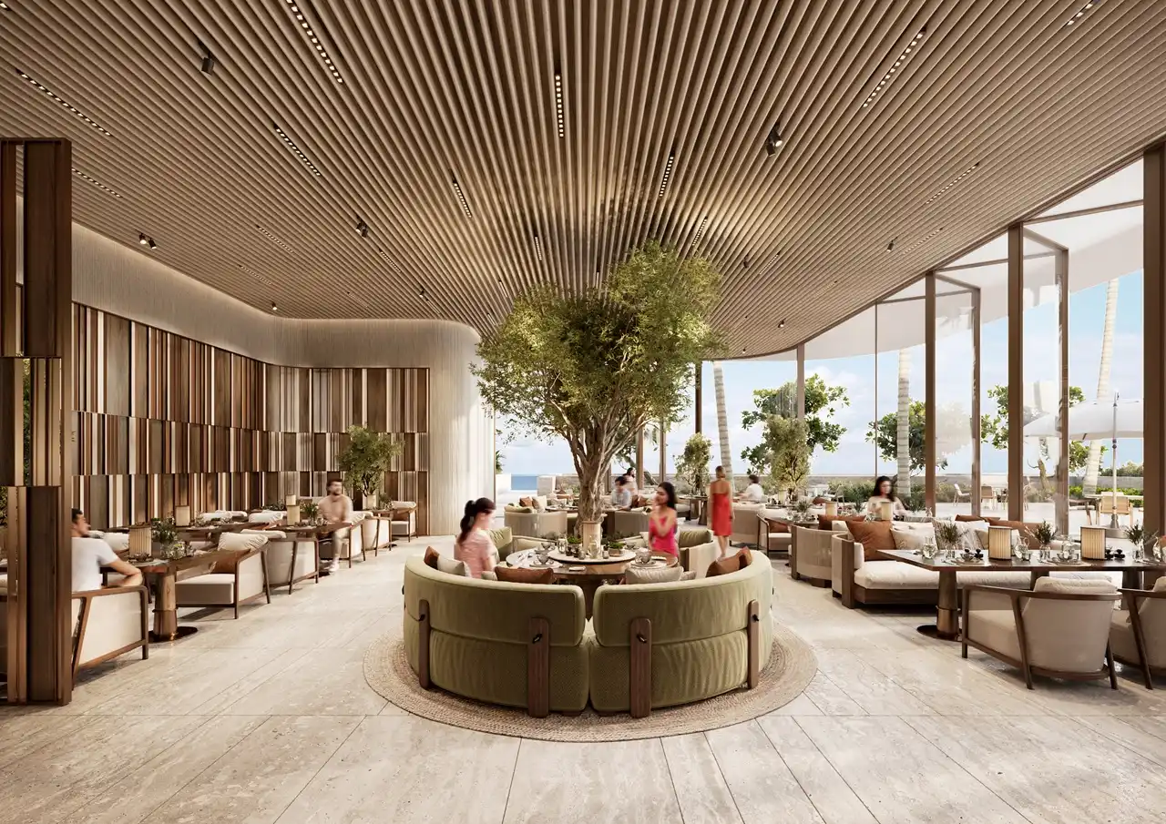 ORLA, Dorchester Collection, Dubai by OMNIYAT beach club lounge featuring luxury seating areas, coastal dining spaces, landscaped interiors, and panoramic beachfront views in Dubai. Presented by Tohid Fetrat