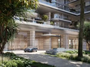 ORLA, Dorchester Collection, Dubai by OMNIYAT grand arrival entrance featuring landscaped surroundings, luxury porte cochere, contemporary architecture, and elegant lobby access in Dubai. Presented by Tohid Fetrat