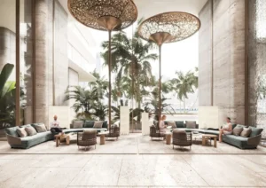 ORLA, Dorchester Collection, Dubai by OMNIYAT grand lobby featuring double height ceilings, designer lighting installations, luxury lounge seating, and landscaped views in Dubai. Presented by Tohid Fetrat