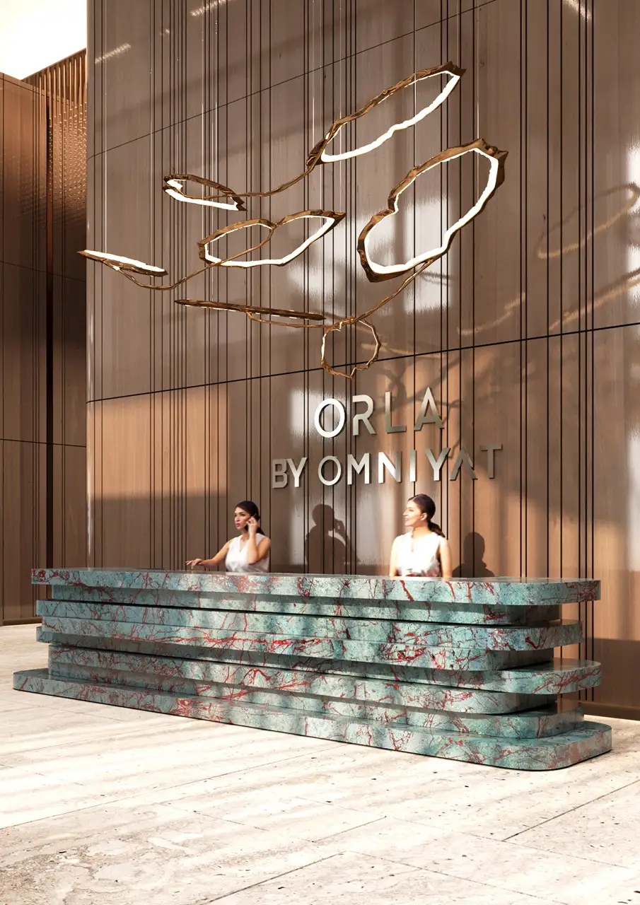 Reception lobby at ORLA, Dorchester Collection, Dubai featuring concierge services, luxury interiors, branded residential hospitality, and exclusive resident arrival experience. Presented by Tohid Fetrat