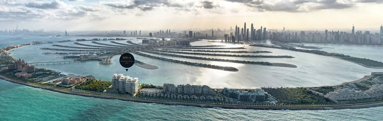 Aerial location overview of ORLA, Dorchester Collection on Palm Jumeirah, showcasing beachfront positioning, Palm fronds, Atlantis, Dubai Marina skyline, and Gulf views. Presented by Tohid Fetrat
