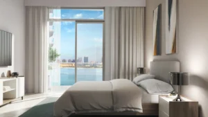 Palace by the Beach at Emaar Beachfront by Emaar luxury bedroom interior with waterfront views and floor to ceiling windows in Dubai Presented by Tohid Fetrat