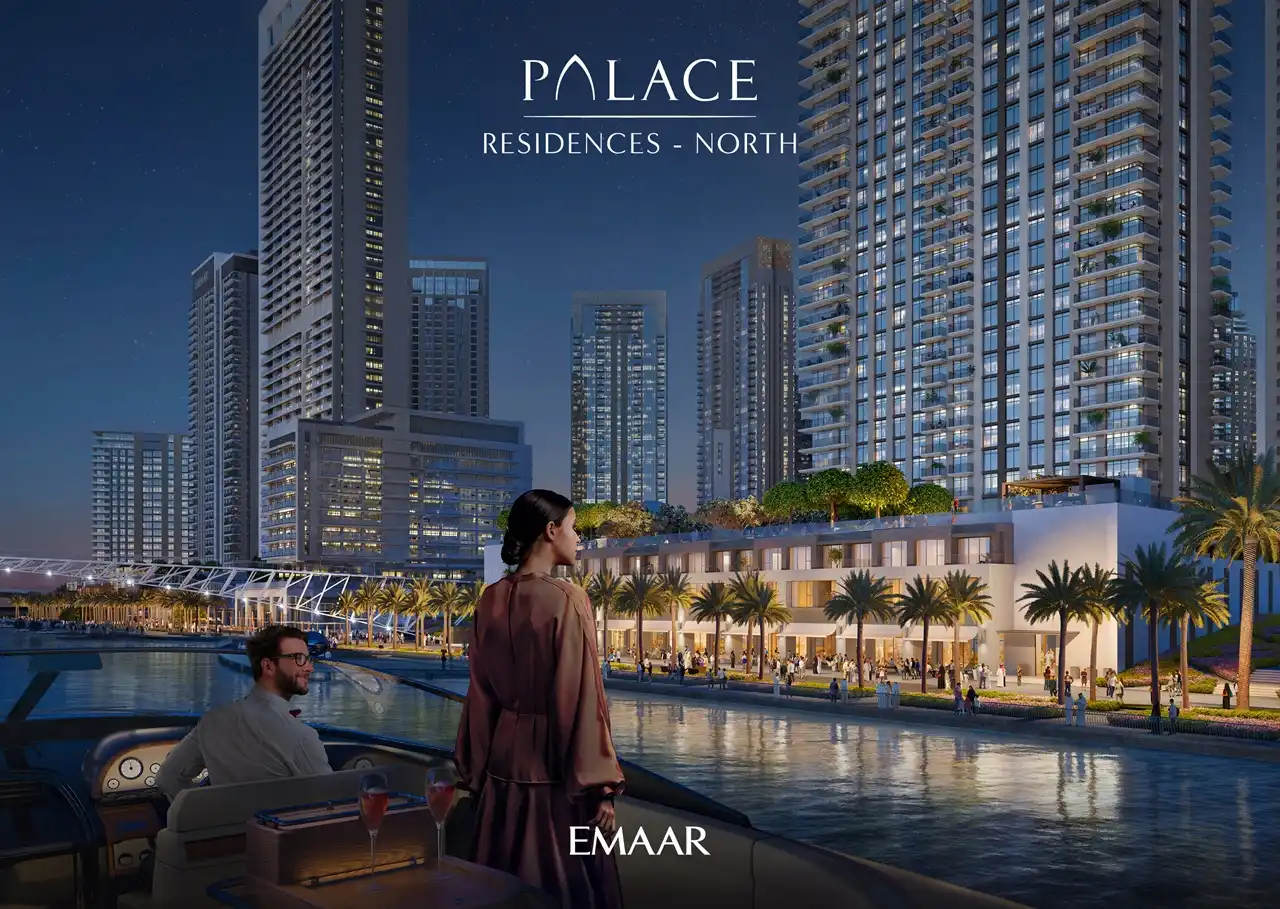Palace Residences North at Dubai Creek Harbour by Emaar Properties waterfront residences illuminated at night overlooking the marina in Dubai Presented by Tohid Fetrat