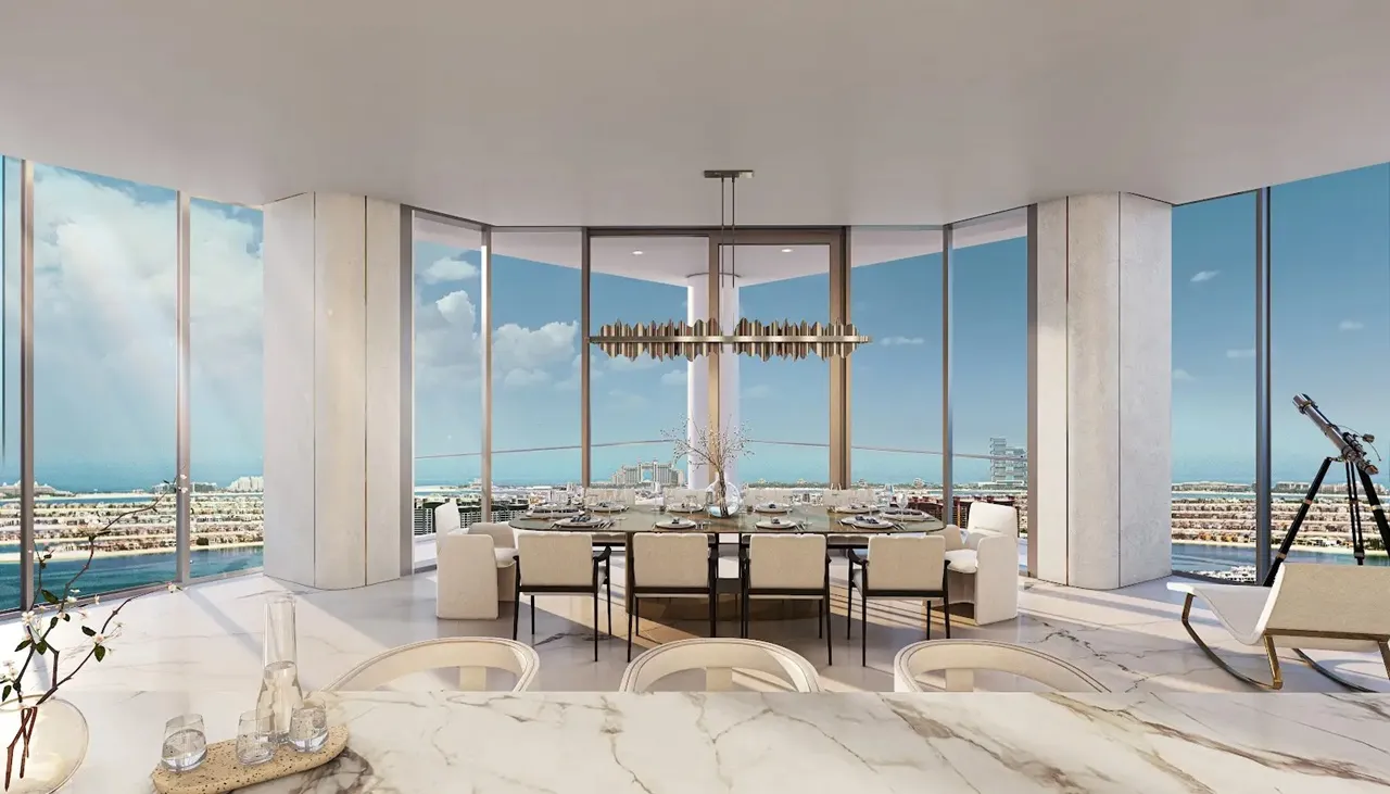 Palm Beach Tower 1 at Palm Jumeirah by Nakheel luxury dining area with panoramic waterfront views and floor to ceiling windows in Dubai Presented by Tohid Fetrat