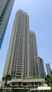 Peninsula Four The Plaza tower façade view in Business Bay Dubai during the 19 June 2026 construction update showing completed residential towers and podium landscaping Captured by Tohid Fetrat