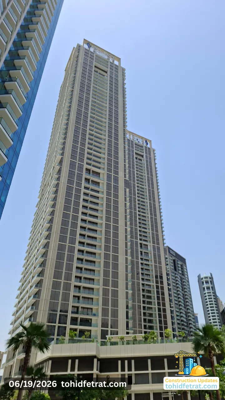 Peninsula Four The Plaza tower façade view in Business Bay Dubai during the 19 June 2026 construction update showing completed residential towers and podium landscaping Captured by Tohid Fetrat