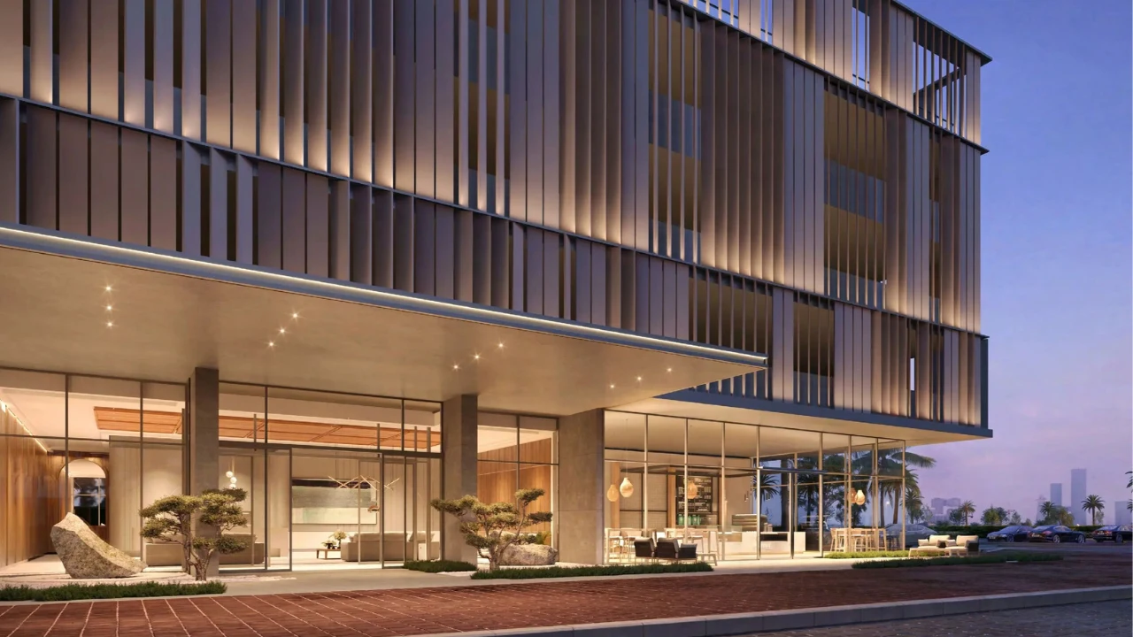 ANWA Aria by OMNIYAT contemporary building entrance with elegant lobby floor to ceiling glazing and refined architectural facade in Dubai Presented by Tohid Fetrat