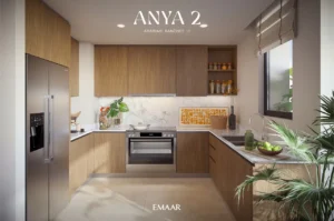 Anya 2 at Arabian Ranches 3 by Emaar Properties contemporary kitchen interior with wooden cabinetry, marble backsplash, integrated appliances, and modern finishes in Dubai - Presented by Tohid Fetrat