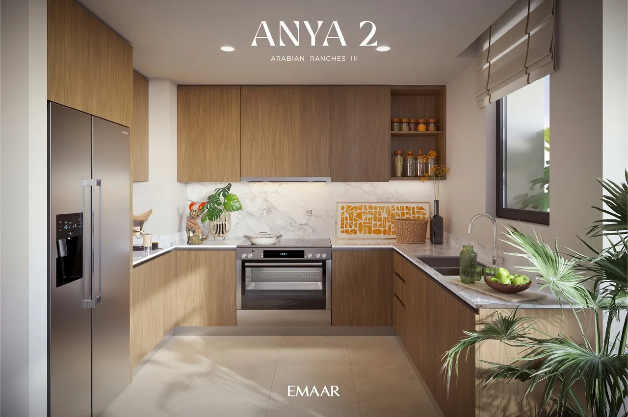 Anya 2 at Arabian Ranches 3 by Emaar Properties contemporary kitchen interior with wooden cabinetry, marble backsplash, integrated appliances, and modern finishes in Dubai - Presented by Tohid Fetrat
