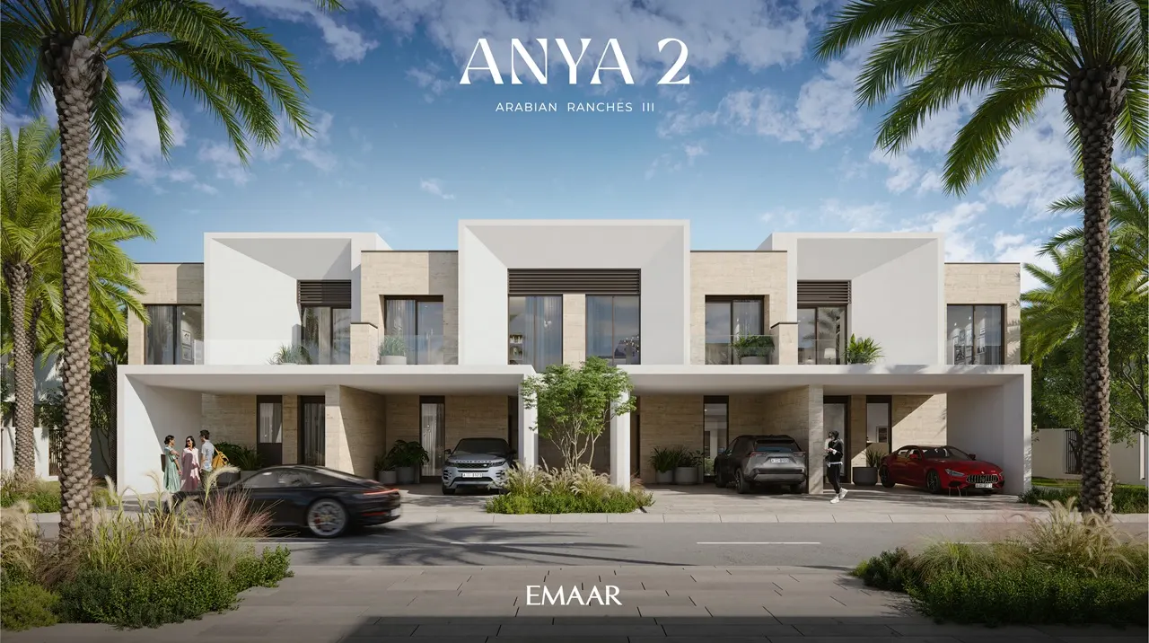 Anya 2 at Arabian Ranches 3 by Emaar Properties modern townhouse street view featuring contemporary architecture, landscaped frontage, covered parking, and palm trees in Dubai - Presented by Tohid Fetrat