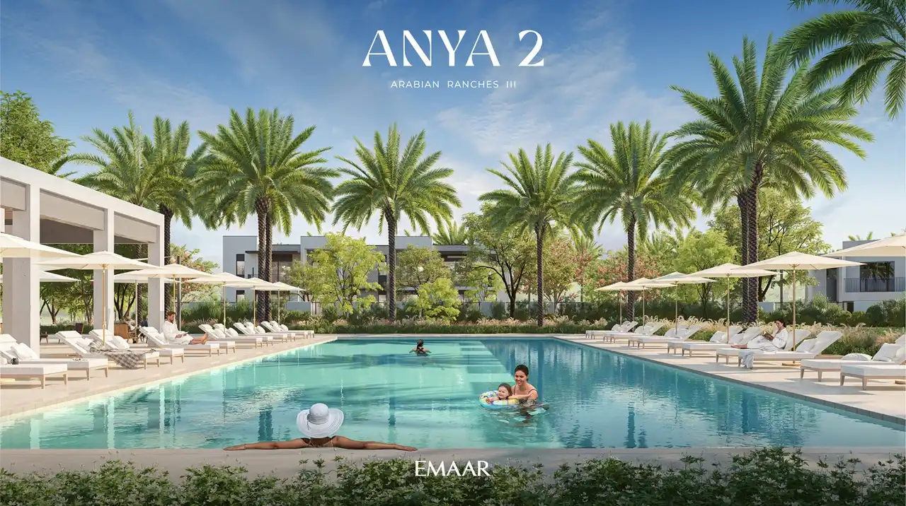 Anya 2 at Arabian Ranches 3 by Emaar Properties resort style swimming pool with sun loungers, landscaped surroundings, palm trees, and outdoor leisure spaces in Dubai - Presented by Tohid Fetrat