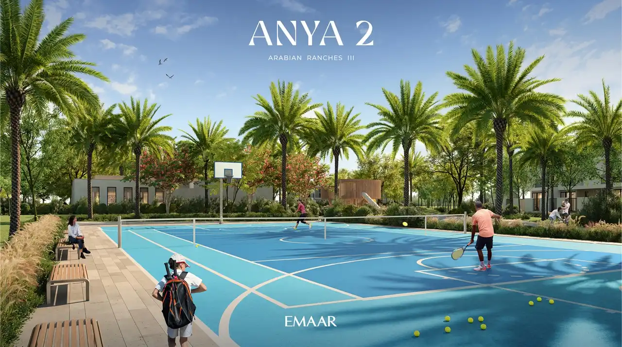 Anya 2 at Arabian Ranches 3 by Emaar Properties outdoor tennis court surrounded by landscaped gardens, palm trees, and recreational spaces in Dubai - Presented by Tohid Fetrat