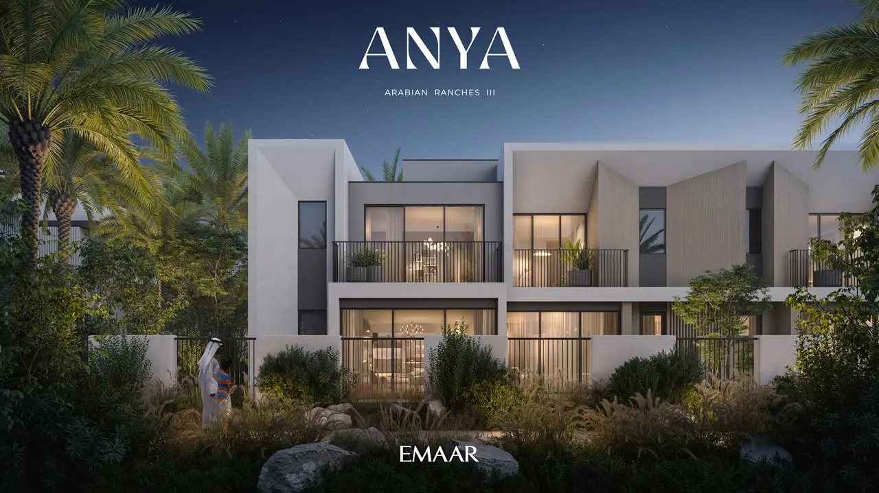 Anya at Arabian Ranches 3 by Emaar Properties contemporary townhouse evening facade with illuminated interiors and landscaped gardens in Dubai Presented by Tohid Fetrat
