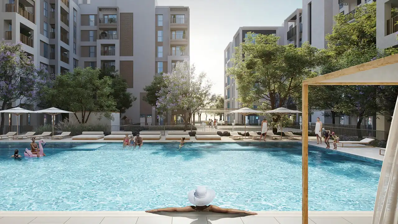Cedar at Dubai Creek Harbour by Emaar Properties outdoor swimming pool surrounded by landscaped gardens and residential buildings in Dubai - Presented by Tohid Fetrat
