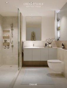 Creek Palace at Dubai Creek Harbour by Emaar Properties modern bathroom interior with glass shower, vanity, mirror, and neutral finishes in Dubai Presented by Tohid Fetrat